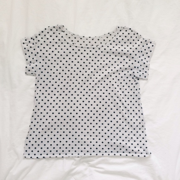 White square top with black polka dots