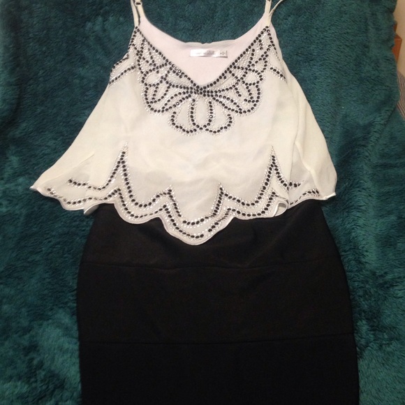 Dress with tight skirt and loose white top!