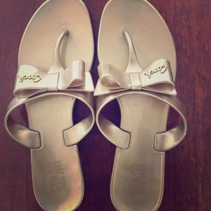 Coach gold jelly bow flip flops