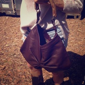 Dark brown leather handbag with wood like handle