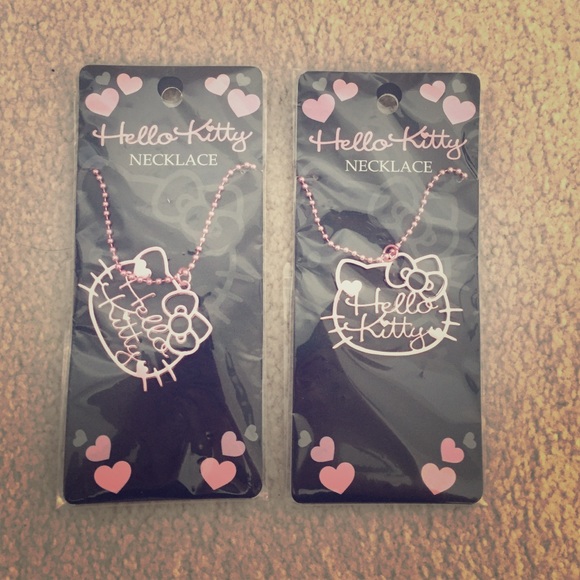 2 brand new hello kitty necklaces and pouch
