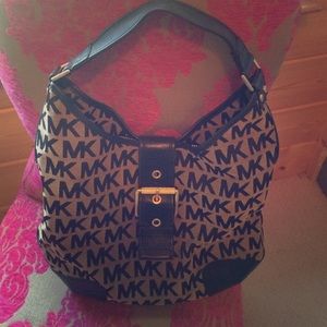 Michael Kors. Black and Tan Shoulder bag