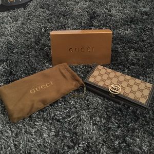 Brown and tan Gucci wallet