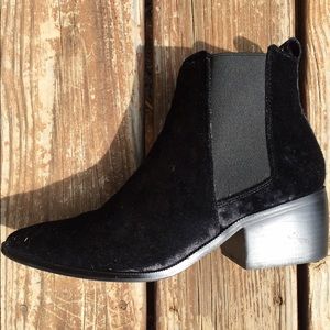 Black, velvet, pointed toe ankle booties.