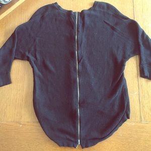 Adorable high-low black sweater with zipper detail