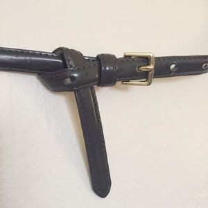Gray patent leather belt
