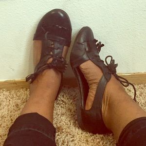 Unique open flat Oxford style shoes.