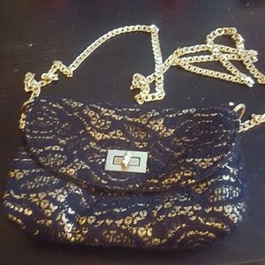 Cute little black cross body wallet .