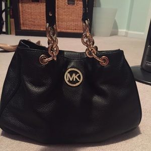 Michael Kors black leather hand bag.