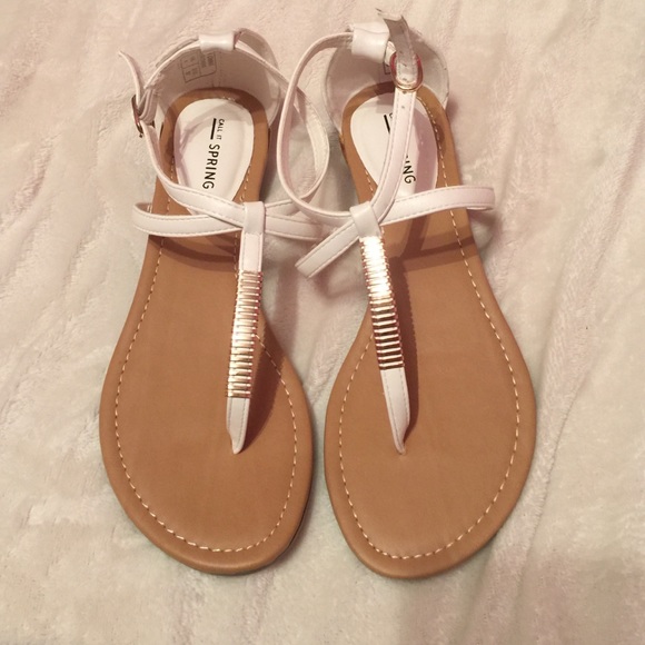 Cute sandals with gold detail.