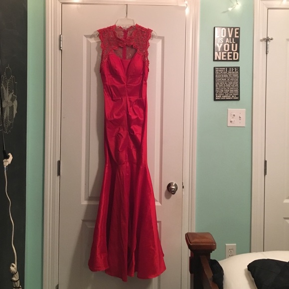 Red, form-fitting, lace-back dress