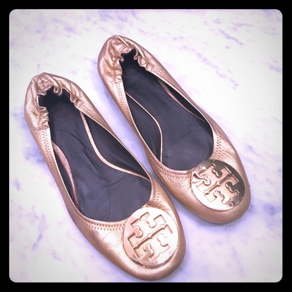 Tory Burch Reva flats in gold.