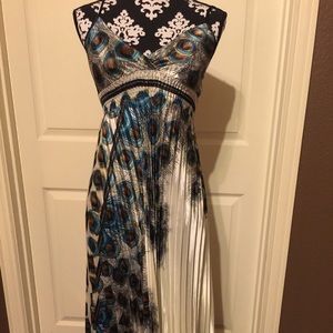 A stunning peacock inspired dress. SizeOS