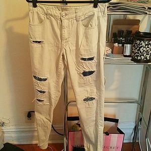 Ripped jeans with dark contrast patches