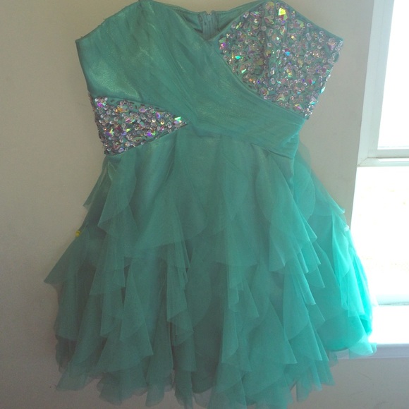 Turquoise gem strapless prom dress.