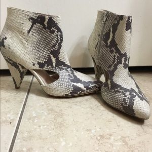 Snakeskin booties with cutouts on the side