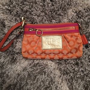 Coach orange and pink wristlet