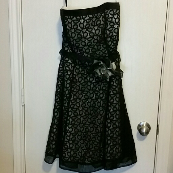 Strapless tea - length lace dress with floral deta