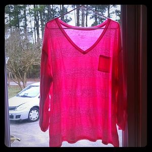 A neon pink striped 3/4 sleeved t-shirt