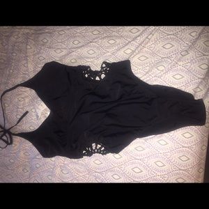 Black full body bathing suit with cut outs