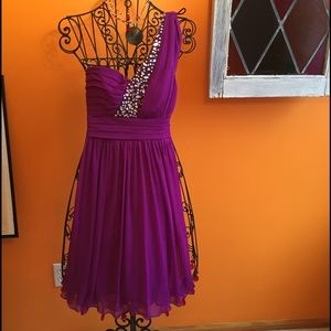 Short purple dress w/ bedazzled shoulder strap.