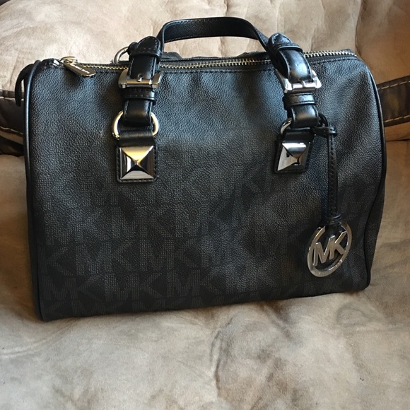 Black Michael Kors Signature Grayson bag.