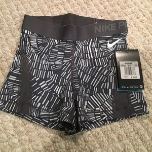 Grey patterned Nike pros