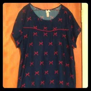 Cute blue blouse with red bows.