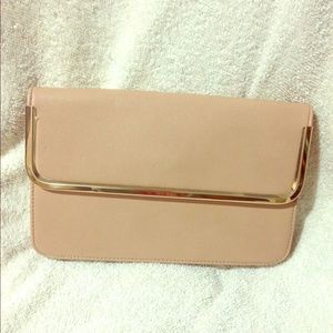 Nude clutch with gold chain