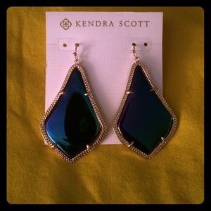 Kendra Scott iridescent blue stone earrings.