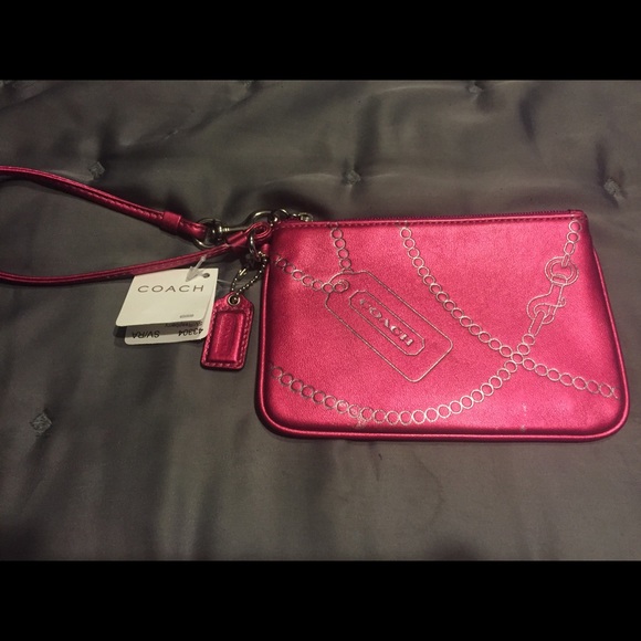 SOLD with black crossbody.  Pink coach wristlet