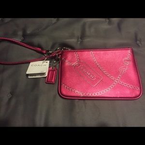 SOLD with black crossbody.  Pink coach wristlet