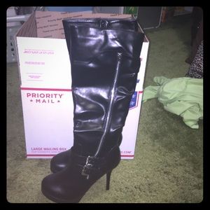 New in box high heeled black boots