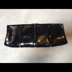 Express faux patent leather clutch.