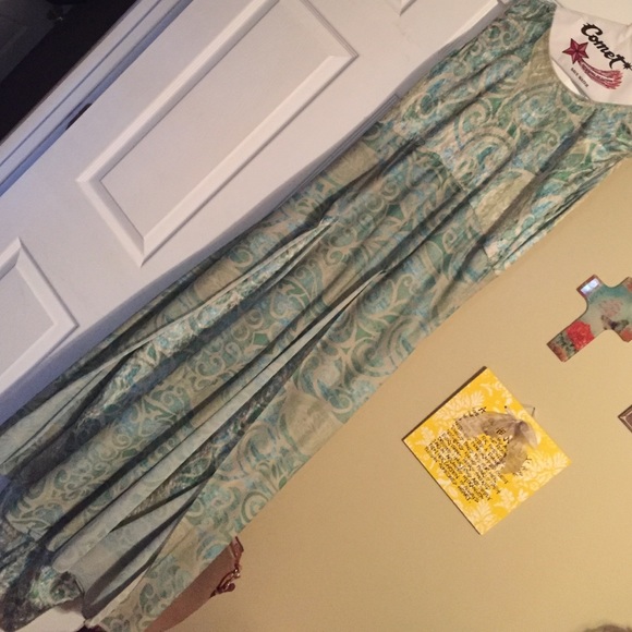 Unitard with slitted skirt. Hole in seam of L leg