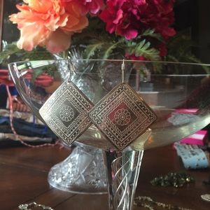 Earrings flat silver patterned French hook.