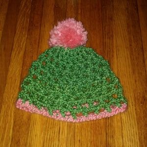 Green and pink crocheted hat