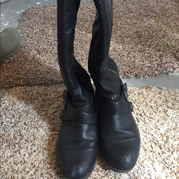 Tall black boots. Very small heel