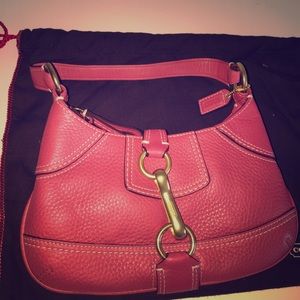 Bright pink Coach bag.