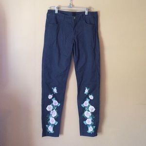 Navy skinny jeans with rose detail