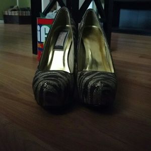 Zebra print gold pumps