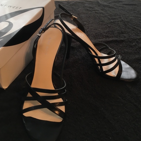 Black strappy leather heels.