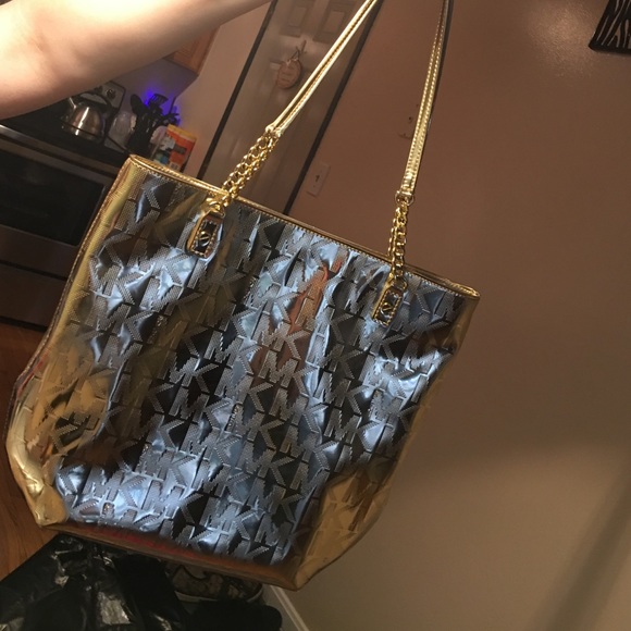 Michael Cors woman's gold purse