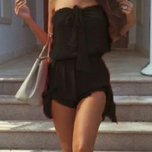 Romper ties in front and ties on the sides.