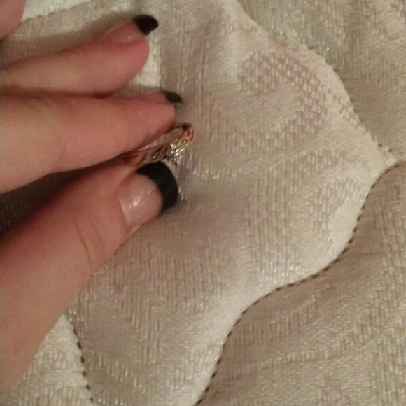 A gold ring with inset diamond's.