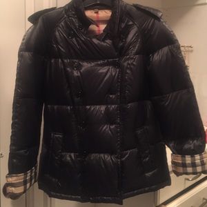 Double breasted Burberry coat.