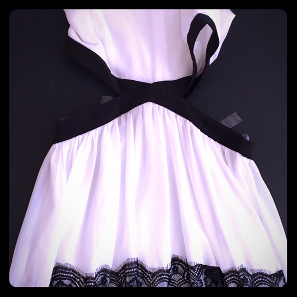 Mini dress. Open sides. Brand new tag