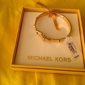 Michael Kors gold buckle bracelet.