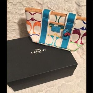 Medium multi design Coach purse with ladybug tag