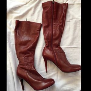 Red high heeled boots.